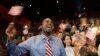 FILE - Jean Naason, 39, of Haiti, left, waves an American flag during a naturalization ceremony administered by the U.S. Citizenship and Immigration Services (USCIS) in Miami, June 5, 2014.