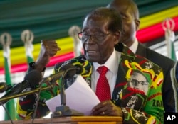 Zimbabwe President Robert Mugabe delivers his speech at the opening session of his party's 16th Annual Peoples Conference in Masvingo, about 300 kilometres, south of the capital Harare, Friday Dec. 16, 2016.