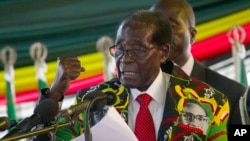 Zimbabwe President Robert Mugabe delivers his speech at the opening session of his party's 16th Annual Peoples Conference in Masvingo, about 300 kilometres, south of the capital Harare, Friday Dec. 16, 2016.