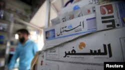 A copy of Lebanese newspaper As-Safir is displayed in front of other newspapers at a shop in Sidon, southern Lebanon, March 24, 2016. 