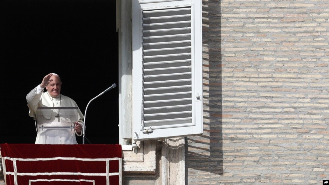 Pope Francis delivers a blessing during his Angelus prayer from his studio window overlooking St. Peter's Square, at the Vatican, Nov. 10, 2019.