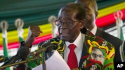 Zimbabwe President Robert Mugabe delivers his speech at the opening session of his party's 16th Annual Peoples Conference in Masvingo, about 300 kilometres, south of the capital Harare, Friday Dec. 16, 2016.