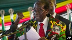 Zimbabwe President Robert Mugabe delivers his speech at the opening session of his party's 16th Annual Peoples Conference in Masvingo, about 300 kilometres, south of the capital Harare, Friday Dec. 16, 2016.