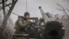 A serviceman of 24th Mechanized brigade enters an adjustment as he fires a self-propelled howitzer, near Chasiv Yar, Nov. 18, 2024. (Press Service of the 24th King Danylo Separate Mechanized Brigade of the Ukrainian Armed Forces/Handout via Reuters) 