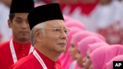 Presiden Organisasi Nasional melayu Bersatu (United Malays National Organisation/UMNO) yang berkuasa dan PM Malaysia Najib Razak dalam upacara pembukaan Rapat Tahunan Partai tersebut di Kuala Lumpur, Malaysia, 10 Desember 2015 (Foto: dok). 