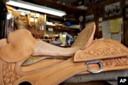 Nancy Martiny builds her saddles from the ground up, eventually carving and stamping designs into the leather.