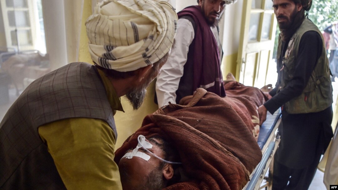 In this photo taken on June 3, 2021, a patient lies on a stretcher before receiving treatment controlled by Taliban militants at a hospital in the Andar district of Ghazni province.