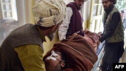 In this photo taken on June 3, 2021, a patient lies on a stretcher before receiving treatment controlled by Taliban militants at a hospital in the Andar district of Ghazni province.