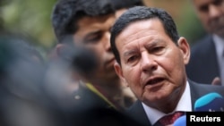 Brazil's Vice President Hamilton Mourao speaks to the media after a meeting of the Lima Group in Bogota, Colombia, Feb. 25, 2019.