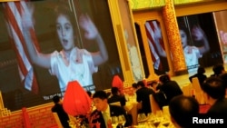 Arabella Kushner, granddaughter of U.S. President Donald Trump, sings traditional Chinese songs in a video as part of Trump's toast as China's President Xi Jinping hosts a state dinner at the Great Hall of the People in Beijing, China, Nov. 9, 2017.