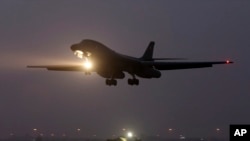 FILE - A B-1 bomber prepares to land after finishing a mission at the al-Udeid Air Base in Doha, Qatar.