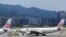 FILE - China Airlines airplanes are parked on the tarmac at Songshan Airport in Taipei, Taiwan, June 24, 2016.