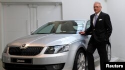 FILE - Skoda Chairman Winfried Vahland poses with a new Skoda Octavia car in this March 20, 2013 photo. 