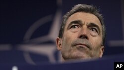 NATO Secretary-General Anders Fogh Rasmussen speaks during a media conference after a meeting of NATO defense ministers at NATO headquarters in Brussels, June 9, 2011.