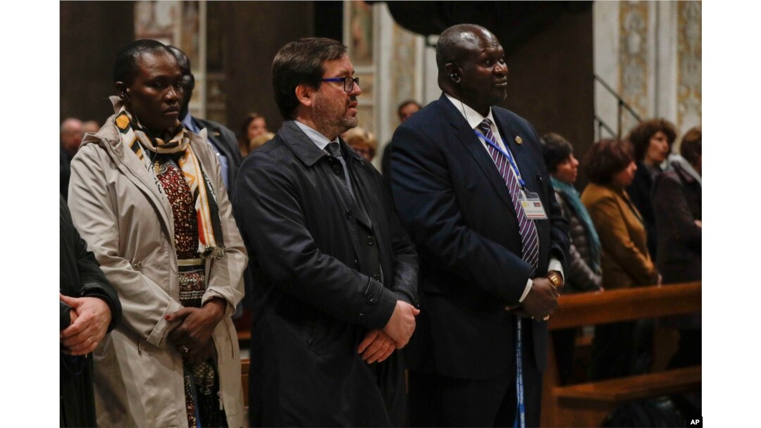 South Sudan Deputy-President Riek Machar, right, attends a prayer for peace event at the Basilica of Santa Maria in Trastevere, in Rome, April 11, 2019.