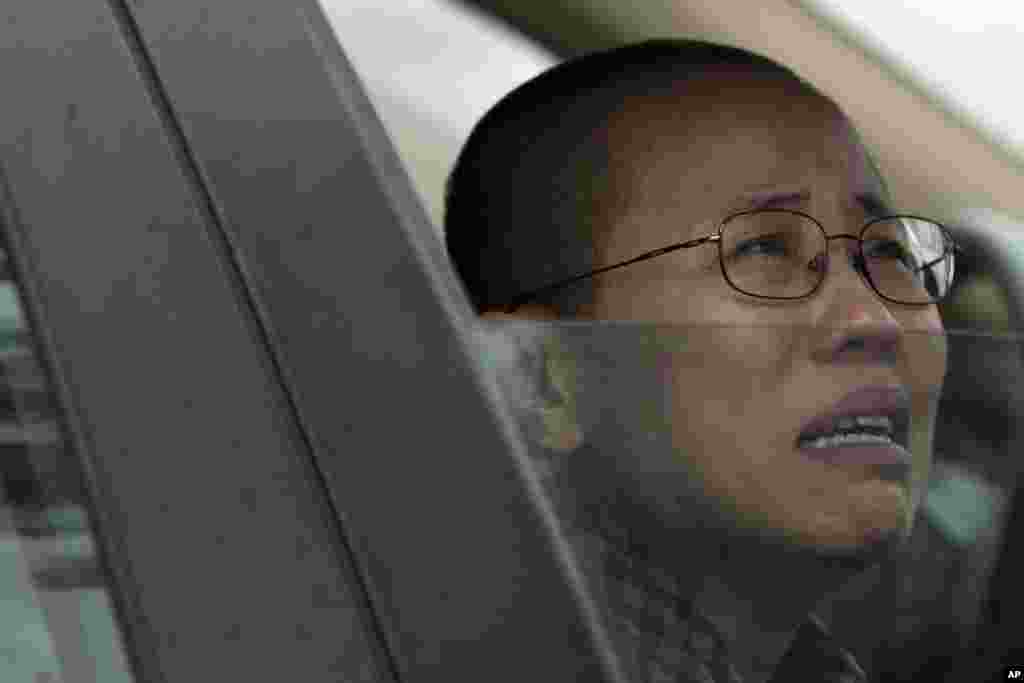 Liu Xia, wife of imprisoned Nobel Peace Prize winner Liu Xiaobo, cries in a car outside Huairou Detention Center where her brother Liu Hui has been jailed in Huairou district, on the outskirts of Beijing, China.