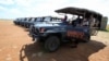 FILE - Gladys Kisemei, a guide, picks up tourists using an electric vehicle at the Maasai Mara National Reserve in Narok County, Kenya, July 16, 2021. The use of EVs is hampered in much of Africa because reliable sources of electricity can be scarce.