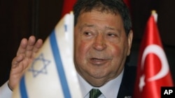 FILE - In this Nov. 24, 2009 file photo, Israel's Industry and Trade Minister Benjamin Ben-Eliezer speaks to the media with Turkish Defense Minister Vecdi Gonul, unseen, after signing a memorandum of understanding in Ankara, Turkey. Trade between Israel a