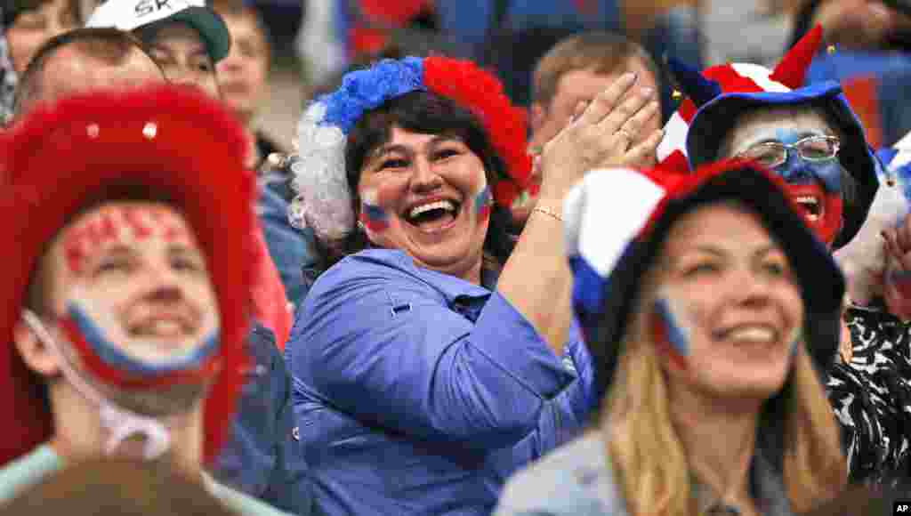 Russian fans support their team during the Group B preliminary round match between Switzerland and Russia at the Ice Hockey World Championship in Minsk, Belarus.