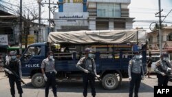 wait for prisoners to be released from Insein Prison in Yangon 