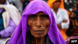 FILE - An Indian participant in the 'Dignity March' looks on as she attends the culmination of the march at Ramleela Ground in New Delhi, Feb. 22, 2019.