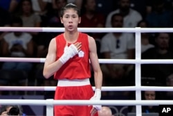 Taiwan's Lin Yu-ting reacts after defeating Uzbekistan's Sitora Turdibekova in their women's 57-kilogram preliminary boxing match at the Summer Olympics on Aug. 2, 2024, in Paris.