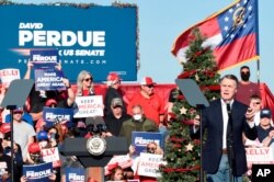 Georgia Sen. David Perdue speaks during a runoff campaign rally with Vice President Mike Pence, Dec. 10, 2020, in Augusta, Georgia.