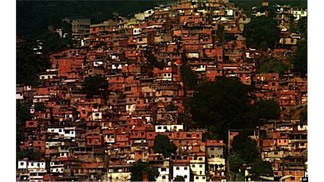 FILE - Houses clutter a hillside in one of the many "favelas," or impoverished neighborhoods, in Rio de Janeiro, Brazil, June 23, 1999.