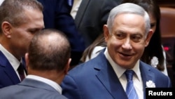 FILE - Israeli Prime Minister Benjamin Netanyahu arrives to attend the swearing-in ceremony of members of Israel's 21st Knesset, or parliament, in Jerusalem, April 30, 2019. 