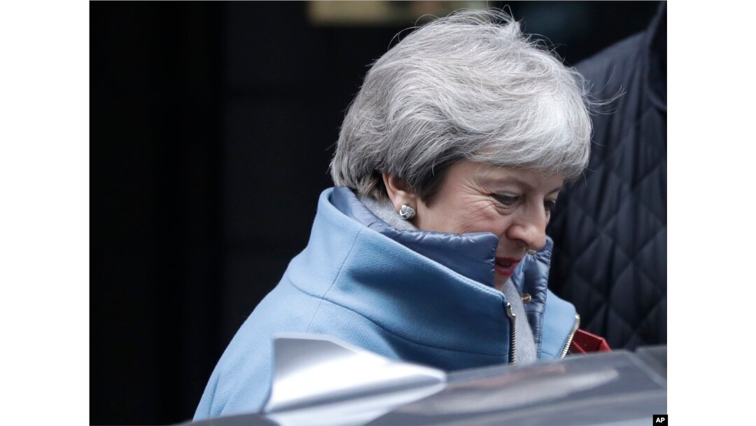 Britain's Prime Minister Theresa May leaves Downing Street to attend parliament in London, Jan. 21, 2019.
