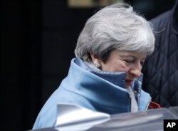 Britain's Prime Minister Theresa May leaves Downing Street to attend parliament in London, Jan. 21, 2019.
