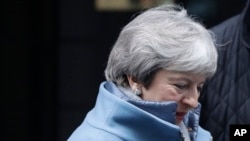 Britain's Prime Minister Theresa May leaves Downing Street to attend parliament in London, Jan. 21, 2019.