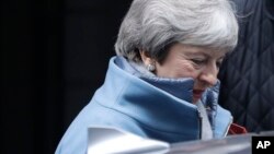 Britain's Prime Minister Theresa May leaves Downing Street to attend parliament in London, Jan. 21, 2019.