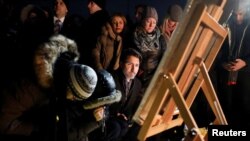 Canada's Prime Minister Justin Trudeau attends a candle light vigil for the victims of Ukraine International Airlines flight PS-752 on Parliament Hill in Ottawa, Jan. 9, 2020. 