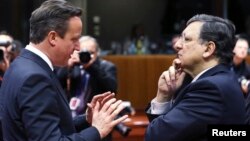 FILE - European Commission President Jose Manuel Barroso (R) and Britain's Prime Minister David Cameron are seen talking during a European Union leaders summit in Brussels.