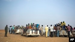 FILE - Nigeriens and third-country migrants head towards Libya from Agadez, Niger on Monday, June 4, 2018. 