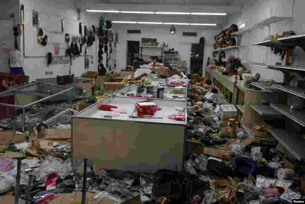 A looted wig shop is seen damaged in Baltimore, Maryland April 28, 2015.