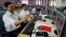 Indian stockbrokers celebrate as they watch the Bombay Stock Exchange (BSE) index on their trading terminal in Mumbai, India, May 13, 2014.