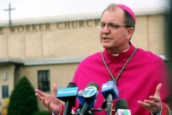 FILE - Bishop John Barres of the Diocese of Rockville Centre speaks to reporters in East Patchogue, N.Y., April 19, 2017.