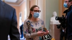 Sen. Kyrsten Sinema, D-Ariz., walks to the chamber after a Senate Democratic Caucus meeting at the Capitol in Washington, Nov. 2, 2021. Sinema, a key holdout on President Joe Biden's social agenda, reached a deal with Senate Majority Leader Chuck Schumer on a plan to lower prescription drug costs for older people, capping out-of-pocket Medicare costs at $2,000 and reducing the price of insulin.