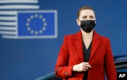 FILE - Danish Prime Minister Mette Frederiksen arrives for an EU summit in Brussels, Oct. 22, 2021.