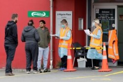 Patients are screened before entering a medical center in central Christchurch, New Zealand, March 24, 2020.