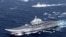 China's Liaoning aircraft carrier with accompanying fleet conducts a drill in an area of South China Sea, in this undated photo taken December 2016. 