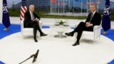FILE - NATO Secretary-General Jens Stoltenberg speaks with U.S. President Joe Biden on the sidelines of a summit at alliance headquarters in Brussels, June 14, 2021. The two will meet again June 12, 2023, at the White House.