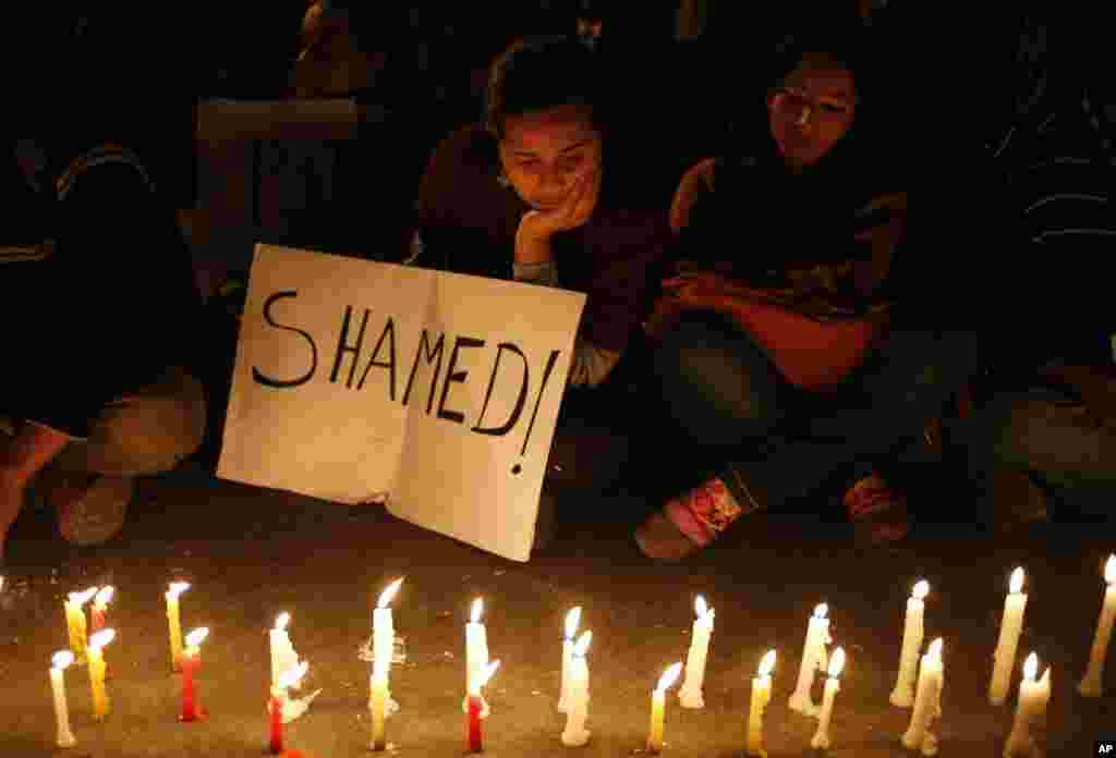 Indian women participate in a candle-lit vigil to mourn the death of a gang rape victim in New Delhi, Saturday, Dec. 29, 2012.