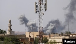 Smoke billows after an air strike by Iraqi forces towards Islamic State militants in the Old City of Mosul, Iraq, June 25, 2017.