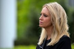 White House press secretary Kayleigh McEnany listens as lawmakers talk about the coronavirus spending bill after meeting with President Donald Trump at White House, April 21, 2020, in Washington.