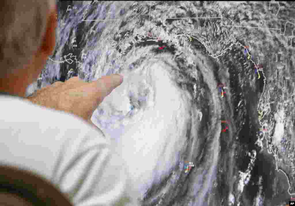 Senior hurricane specialist Stacy Stewart tracks Isaac at the National Hurricane Center in Miami, Aug. 28, 2012. 