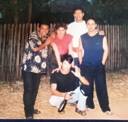This file photo shows Srey Bandaul with French art teacher Véronique Decrop and his friends from the refugee camp, many years after they founded and run Phare Ponleu Selpak. (Courtesy of Phare Ponleu Selapak)
