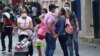  People wear face masks near the Venezuelan-Colombia border.